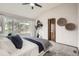 Bright bedroom with a large window, ceiling fan, and neutral tones at 6132 Terry Ct, Arvada, CO 80403