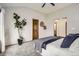 Spacious bedroom with ensuite bath, featuring natural light and a modern aesthetic at 6132 Terry Ct, Arvada, CO 80403