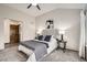 Comfortable bedroom with plush carpeting, a queen bed, and stylish decor at 6132 Terry Ct, Arvada, CO 80403