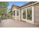 Spacious deck with sliding glass doors and ample space for outdoor enjoyment and entertaining at 6132 Terry Ct, Arvada, CO 80403