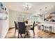 Open-concept dining room adjacent to a modern kitchen at 6132 Terry Ct, Arvada, CO 80403