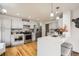Bright, modern kitchen with stainless steel appliances and quartz countertops at 6132 Terry Ct, Arvada, CO 80403