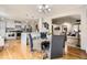 Open concept dining and kitchen area, connecting to the living room at 6132 Terry Ct, Arvada, CO 80403