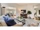 Cozy living room featuring a fireplace and neutral decor at 6132 Terry Ct, Arvada, CO 80403