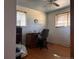 Bedroom featuring hardwood floors, two windows and a vintage desk at 8463 W Arizona Dr, Lakewood, CO 80232