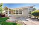 Backyard patio with stone pavers and lush landscaping, perfect for outdoor entertaining at 9845 Keenan St, Highlands Ranch, CO 80130