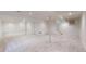 Expansive finished basement with neutral carpet, bright lighting, and multiple storage closets at 9845 Keenan St, Highlands Ranch, CO 80130