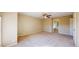 Large bedroom with neutral walls, plush carpeting, and a doorway leading to an ensuite bathroom at 9845 Keenan St, Highlands Ranch, CO 80130