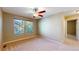 Serene bedroom with a ceiling fan and large windows offering ample natural light at 9845 Keenan St, Highlands Ranch, CO 80130