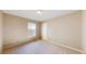 Comfortable bedroom with soft carpet, a window, and a closet for storage at 9845 Keenan St, Highlands Ranch, CO 80130