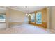 Elegant dining area illuminated by a chandelier and natural light at 9845 Keenan St, Highlands Ranch, CO 80130