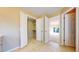 Inviting entryway featuring tile floors, neutral walls, and a convenient walk-in closet at 9845 Keenan St, Highlands Ranch, CO 80130