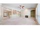 Spacious living room featuring a fireplace, built-in shelves, and a staircase with decorative columns at 9845 Keenan St, Highlands Ranch, CO 80130