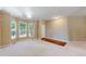 Bright living room featuring a bay window and hardwood accents for a comfortable and inviting atmosphere at 9845 Keenan St, Highlands Ranch, CO 80130