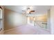 Bright, spacious loft area with a ceiling fan and staircase access, ideal for relaxation at 9845 Keenan St, Highlands Ranch, CO 80130
