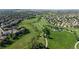 Scenic neighborhood with homes nestled among green spaces and winding paths in a Primary planned community at 9845 Keenan St, Highlands Ranch, CO 80130