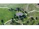 Overhead shot of a park featuring a basketball court surrounded by green grass and walking paths at 9845 Keenan St, Highlands Ranch, CO 80130