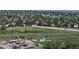 Aerial view features sports fields, playgrounds and park with expansive parking near local neighborhood at 9845 Keenan St, Highlands Ranch, CO 80130