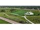 Aerial view of a well-maintained soccer field surrounded by walking paths and green spaces at 9845 Keenan St, Highlands Ranch, CO 80130