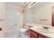 Clean bathroom featuring a tub, shower, and vanity with sink at 11612 E Cornell Cir, Aurora, CO 80014