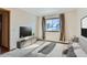 This bedroom features a flat screen TV and an outside view at 11612 E Cornell Cir, Aurora, CO 80014