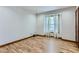 Empty bedroom with hardwood floors and a window providing ample light at 11612 E Cornell Cir, Aurora, CO 80014