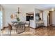 Dining area next to kitchen featuring modern furnishings and hardwood floors at 11612 E Cornell Cir, Aurora, CO 80014