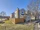 Charming townhome with neutral siding, a stone chimney, and well-maintained landscaping at 11612 E Cornell Cir, Aurora, CO 80014
