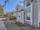 Attractive townhome exterior with neutral siding, well-maintained landscaping, and inviting front porch at 11612 E Cornell Cir, Aurora, CO 80014