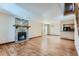 Spacious living room with stone fireplace, hardwood floors and lots of natural light at 11612 E Cornell Cir, Aurora, CO 80014