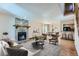 Inviting living room features a stone fireplace, hardwood floors and an open layout for easy entertaining at 11612 E Cornell Cir, Aurora, CO 80014