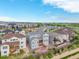 A serene aerial view showcases the backyard of the gray home, complemented by a well-developed surrounding neighborhood at 12953 Bridge View Ln, Parker, CO 80134
