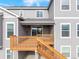 Back deck and wooden staircase showcases the exterior features at 12953 Bridge View Ln, Parker, CO 80134