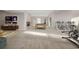Large basement area includes a pool table, exercise equipment, TV and seating area, offering versatile living space at 12953 Bridge View Ln, Parker, CO 80134