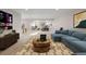 Basement area featuring a lounge with a sectional couch and a home gym, perfect for relaxation and fitness at 12953 Bridge View Ln, Parker, CO 80134