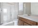Modern bathroom with a glass-enclosed shower, wood cabinets, and a clean, contemporary design at 12953 Bridge View Ln, Parker, CO 80134