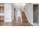 Spacious entryway with hardwood floors, high ceilings, and a staircase leading to the upper level at 12953 Bridge View Ln, Parker, CO 80134