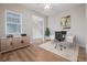 Contemporary home office featuring a modern desk, ample storage, and natural light from a nearby window at 12953 Bridge View Ln, Parker, CO 80134