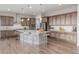 Spacious kitchen with a large island, stainless steel appliances, and ample counter space for cooking and entertaining at 12953 Bridge View Ln, Parker, CO 80134