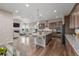 A modern kitchen with stainless steel appliances, a large island, and an open design perfect for gatherings at 12953 Bridge View Ln, Parker, CO 80134