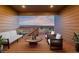 Cozy covered deck with comfortable seating and stunning views of the surrounding landscape and distant horizon at 12953 Bridge View Ln, Parker, CO 80134