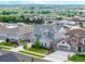 A sunny day street view highlights the home's exterior at 12953 Bridge View Ln, Parker, CO 80134