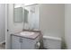 Bathroom featuring a vanity with a large mirror and a toilet at 7414 S Alkire St # 101, Littleton, CO 80127