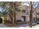 Multi-story condominium building showcasing manicured landscaping and exterior features at 7414 S Alkire St # 101, Littleton, CO 80127