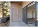 Outdoor patio featuring a sliding glass door and air conditioning units at 7414 S Alkire St # 101, Littleton, CO 80127