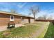 Backyard with a small concrete patio, perfect for outdoor relaxation at 902 Pacific Pl, Fort Lupton, CO 80621