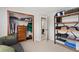 Spacious bedroom offering closet space and rustic open shelving at 902 Pacific Pl, Fort Lupton, CO 80621