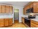 Well-equipped kitchen with stainless steel appliances and convenient pantry access at 6000 W Floyd Ave # 116, Denver, CO 80227