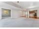 Expansive living area connecting to the kitchen and another room at 6000 W Floyd Ave # 116, Denver, CO 80227