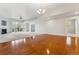Bright open living area with a fireplace and balcony access at 6000 W Floyd Ave # 116, Denver, CO 80227